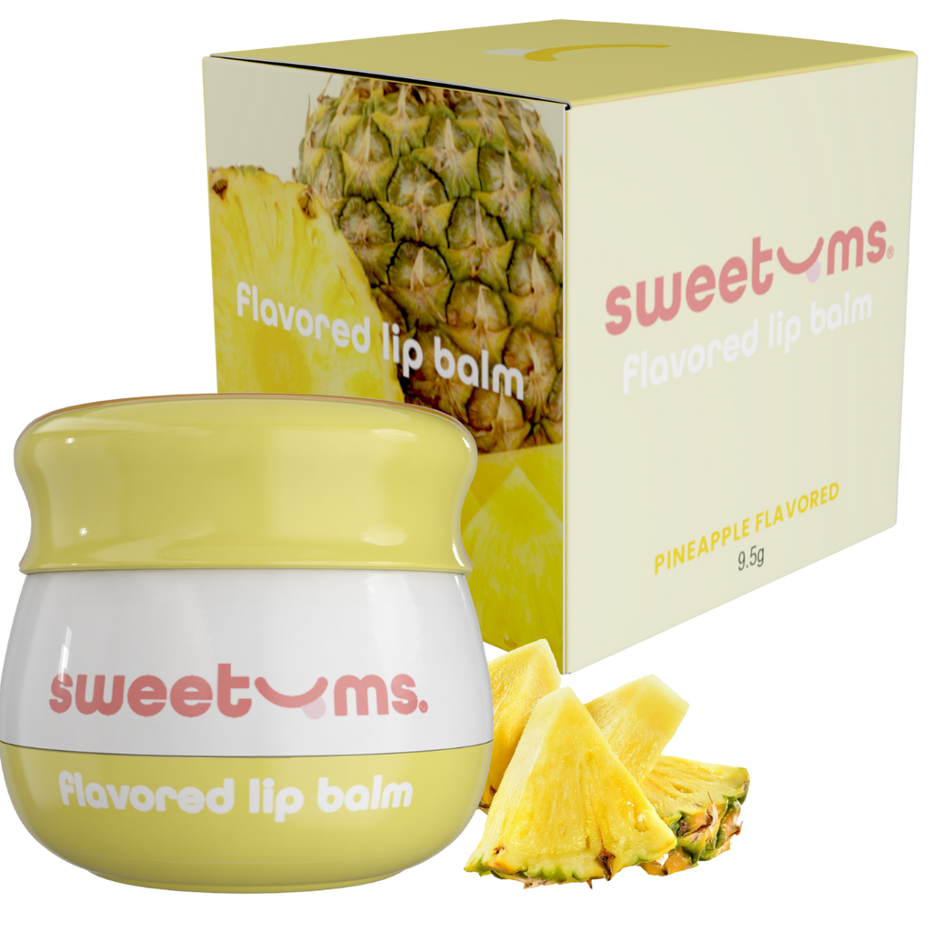 Pineapple-flavored lip balm jar, yellow balm, with Sweetums box and pineapple pieces