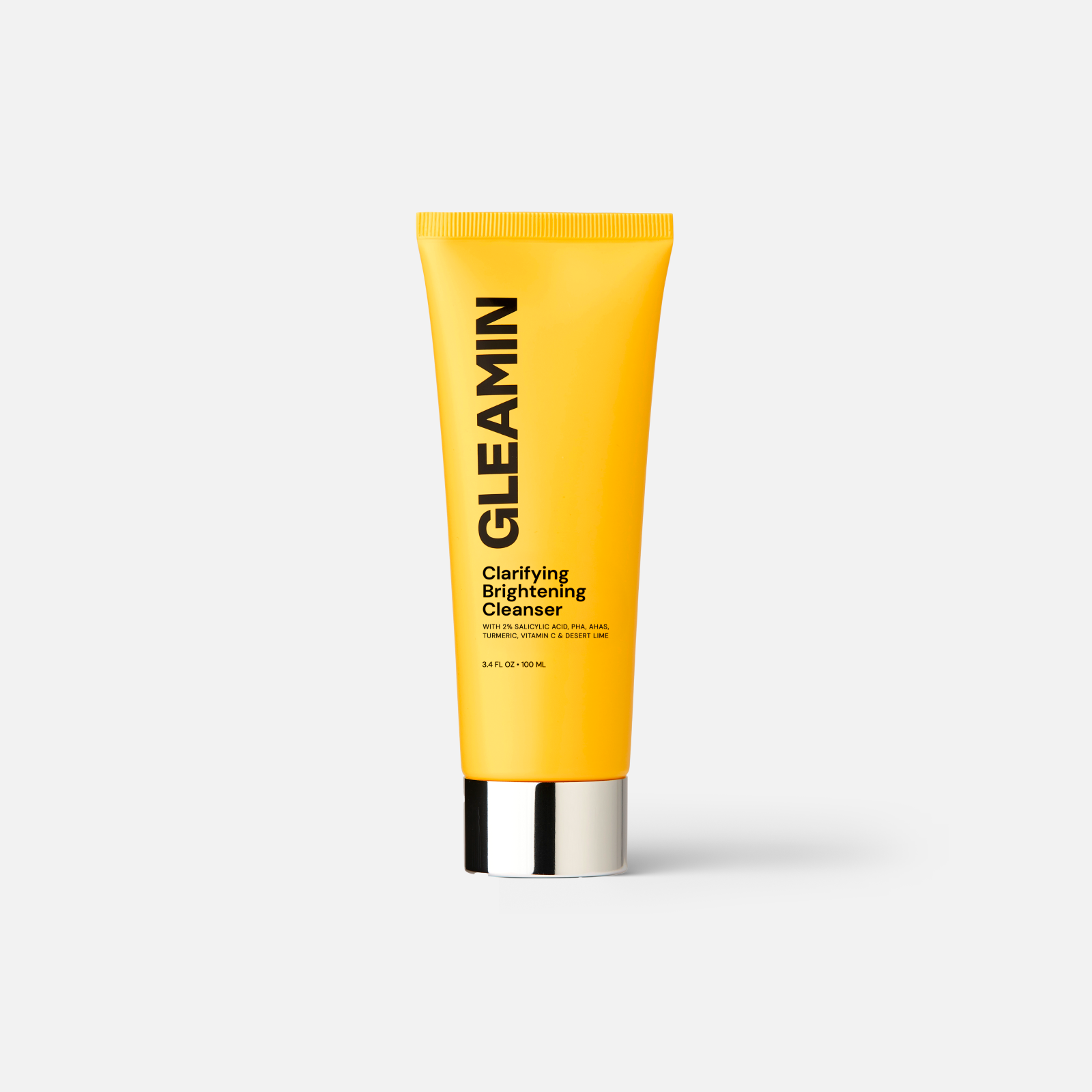 Clarifying brightening cleanser tube in yellow with black-and-silver base