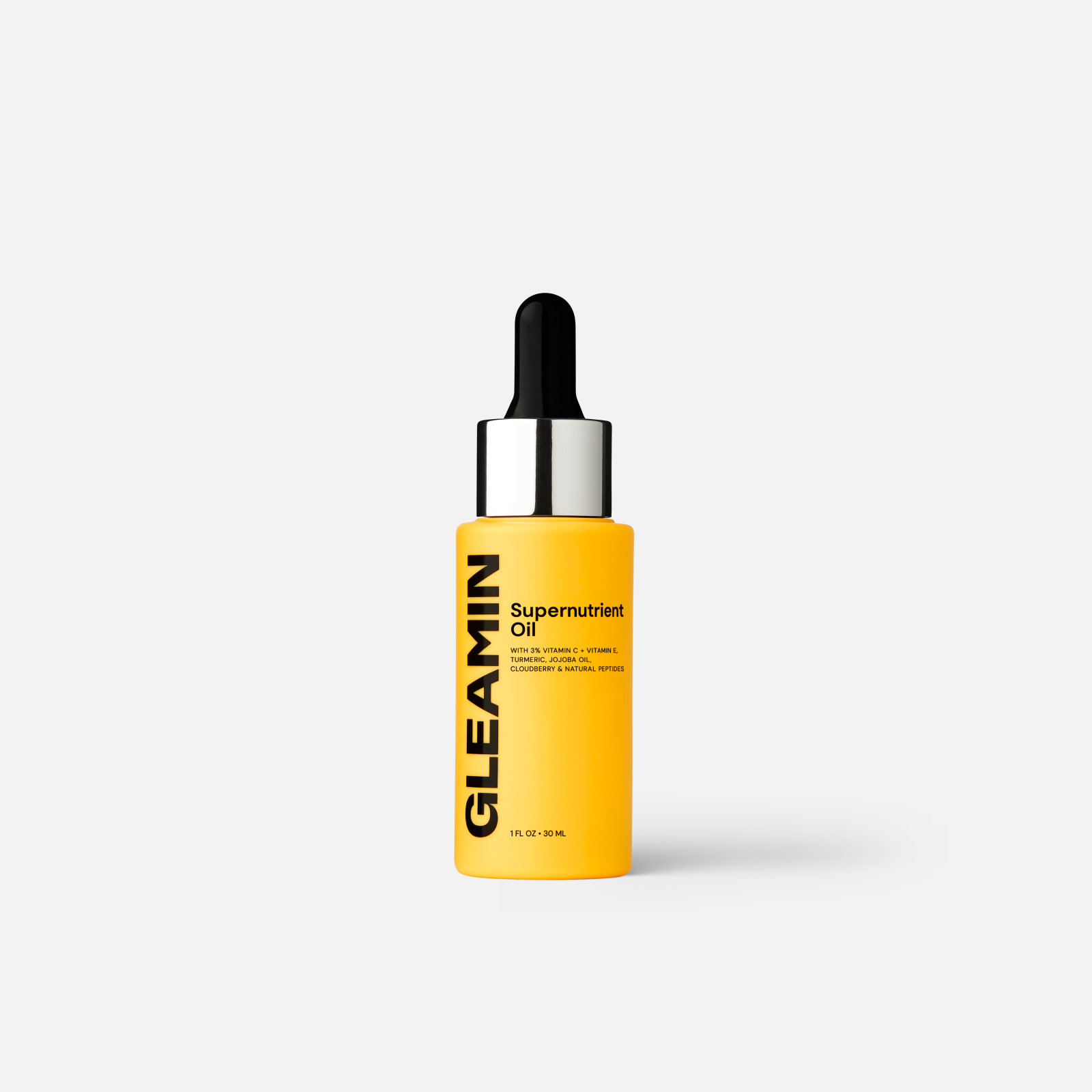 Supernutrient oil bottle with black dropper and yellow liquid, glass container