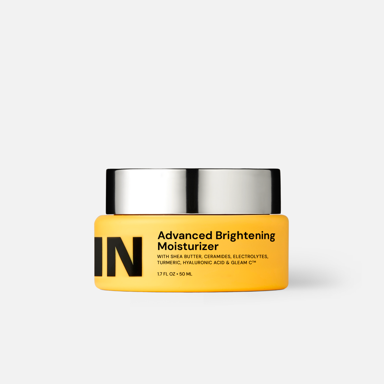 Yellow moisturizer jar with silver lid, GLEAMIN logo on front.