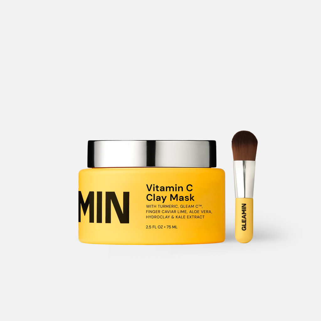 Vitamin C clay mask jar with silver lid and applicator brush