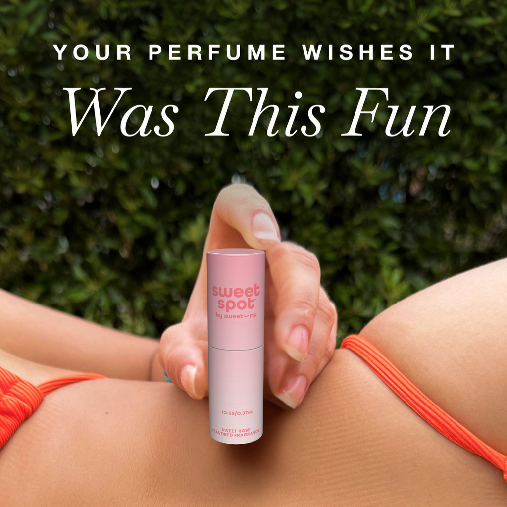 Rose flavored fragrance stick held in hand, pink tube with cap