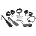 10-piece black bondage accessory set with cuffs, chains, blindfold, and paddle