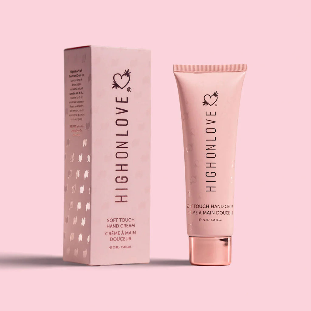 Pink hand cream tube with matching box set, heart-flower logo on front